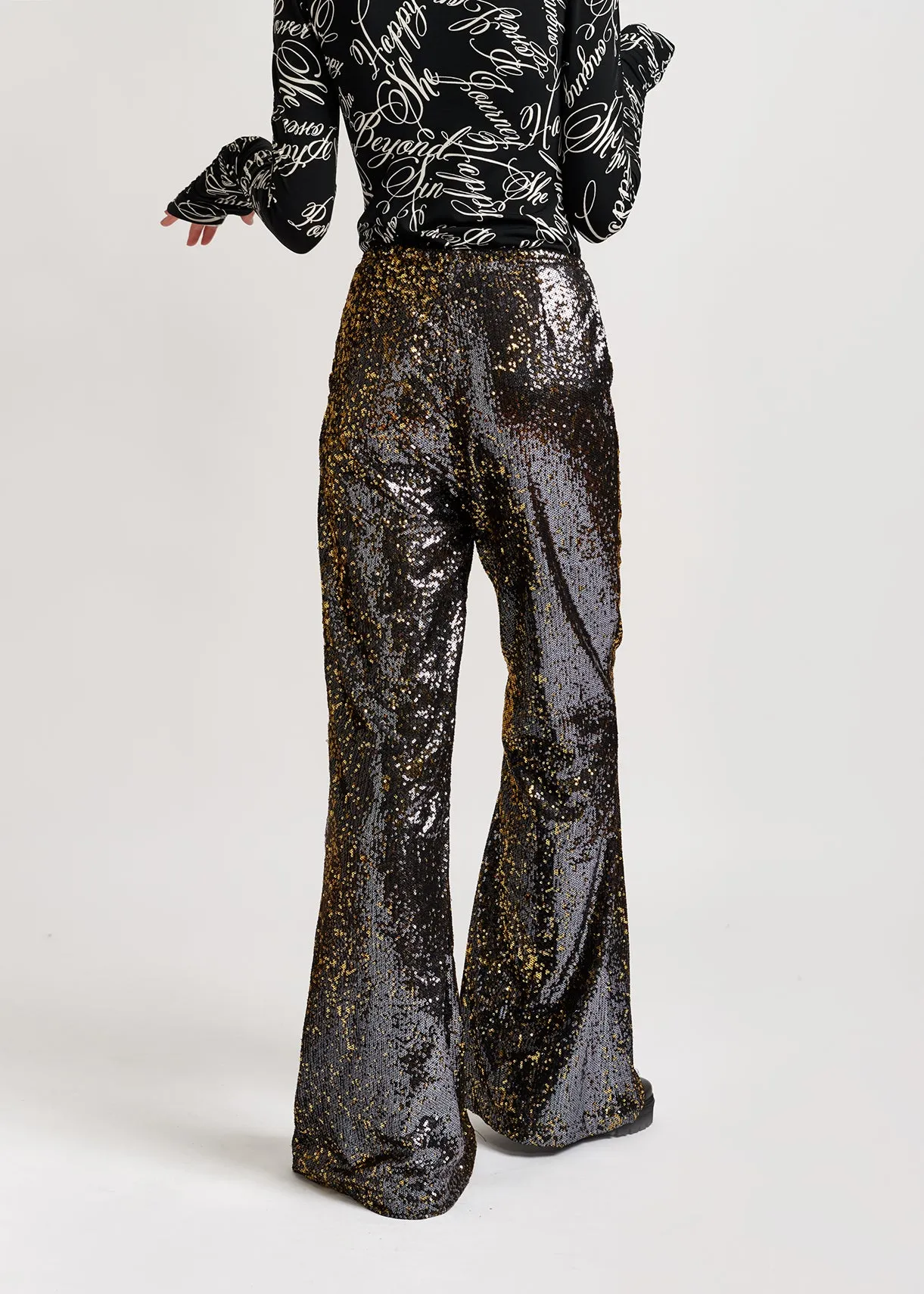 Black and gold sequined flared pants