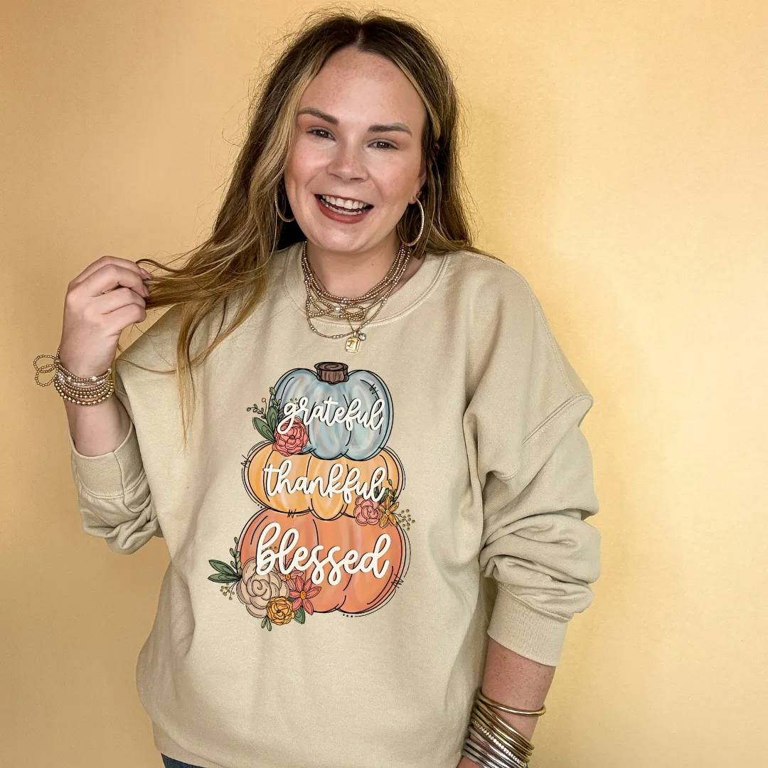 Online Exclusive | Grateful, Thankful, Blessed Stacked Pumpkins and Floral Arrangement Graphic Sweatshirt in Multiple Color Options